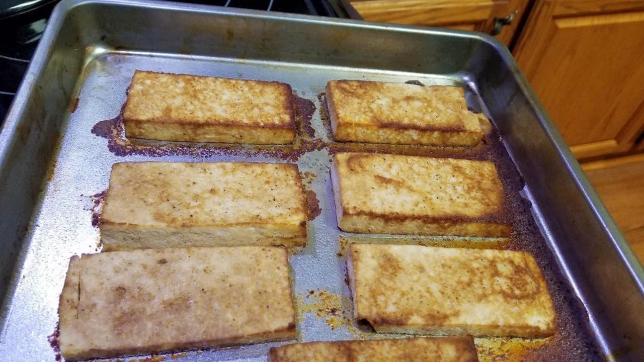 Drained tofu with ingredients for marinade